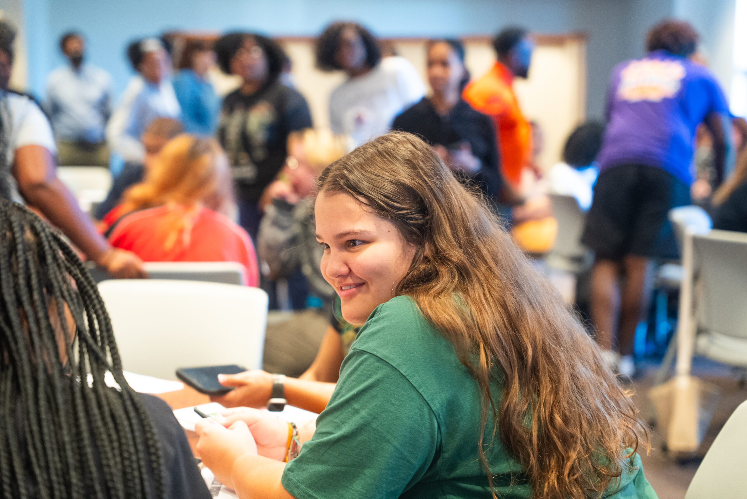 NSU student smiles in classroom