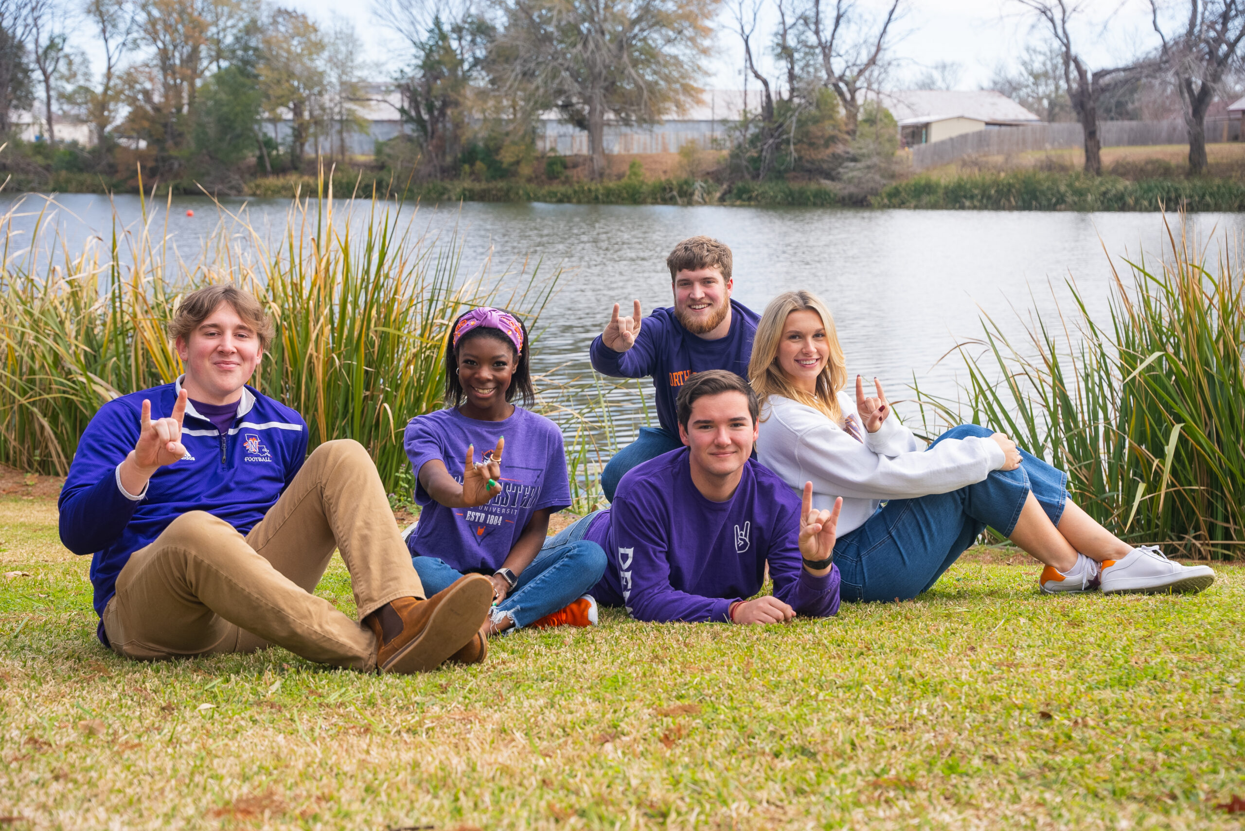 NSU students pose on the lawn by Chaplin's Lake