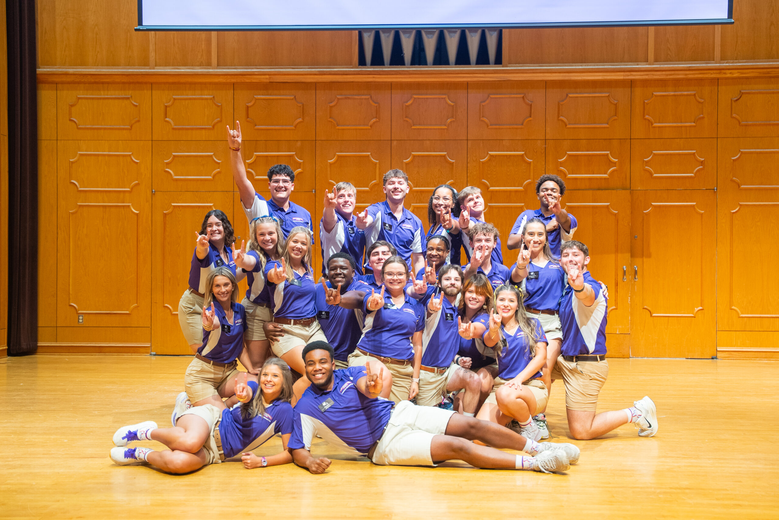 NSU Freshman Connection team pose for a photo on stage