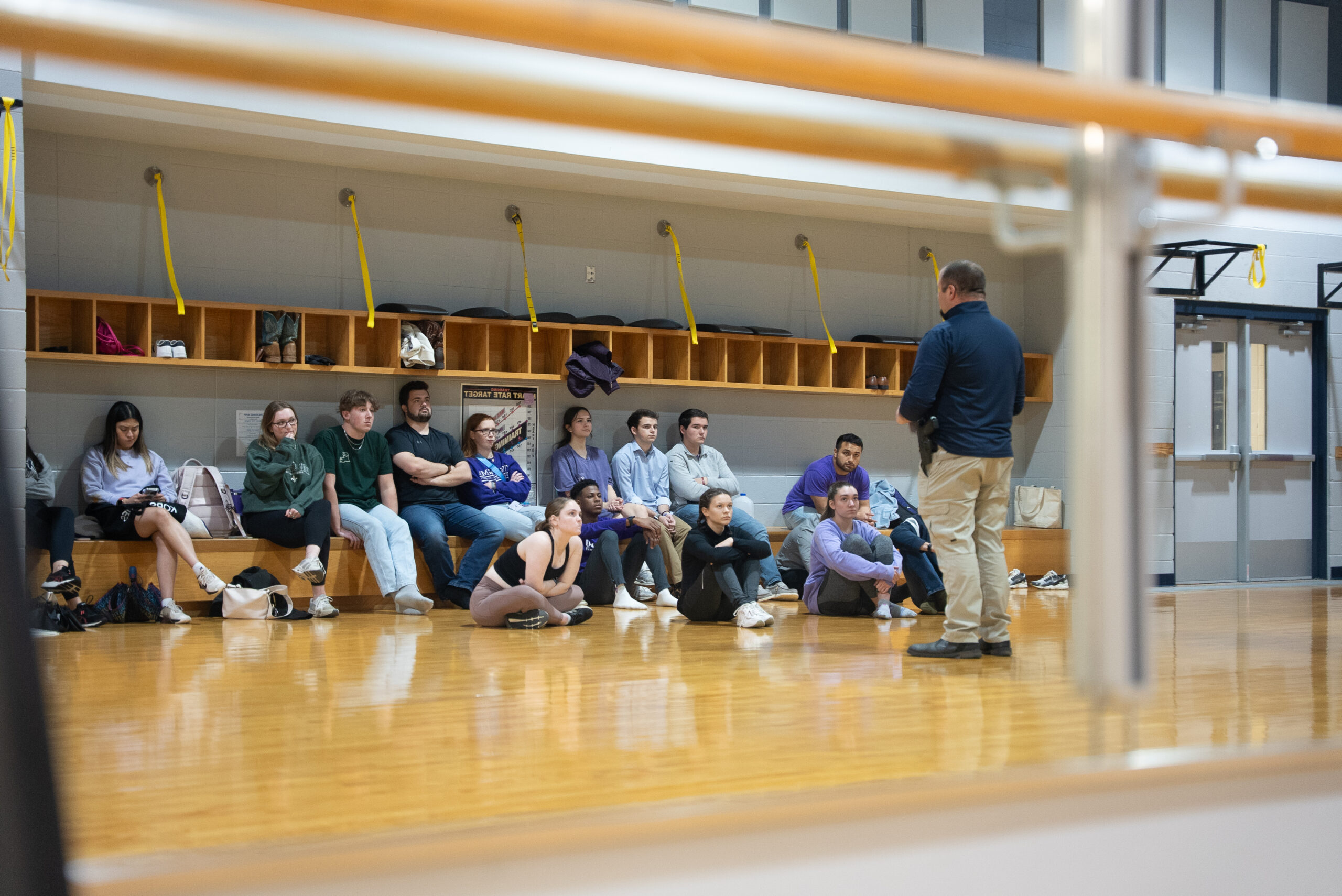 NSU students listen to a police officer during a self-defense class at the WRAC