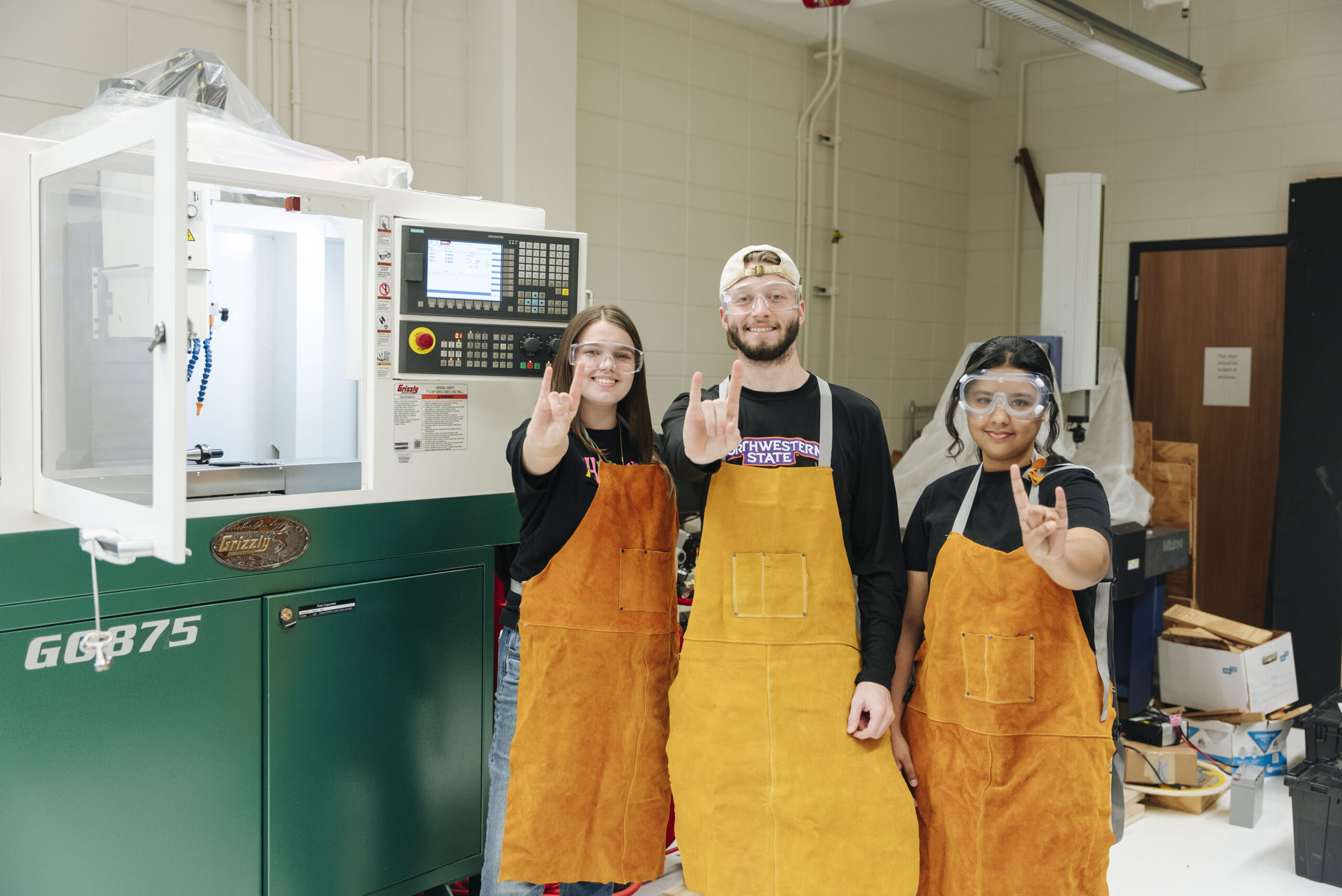 NSU Engineering students pose for a photo in the manufacturing lab