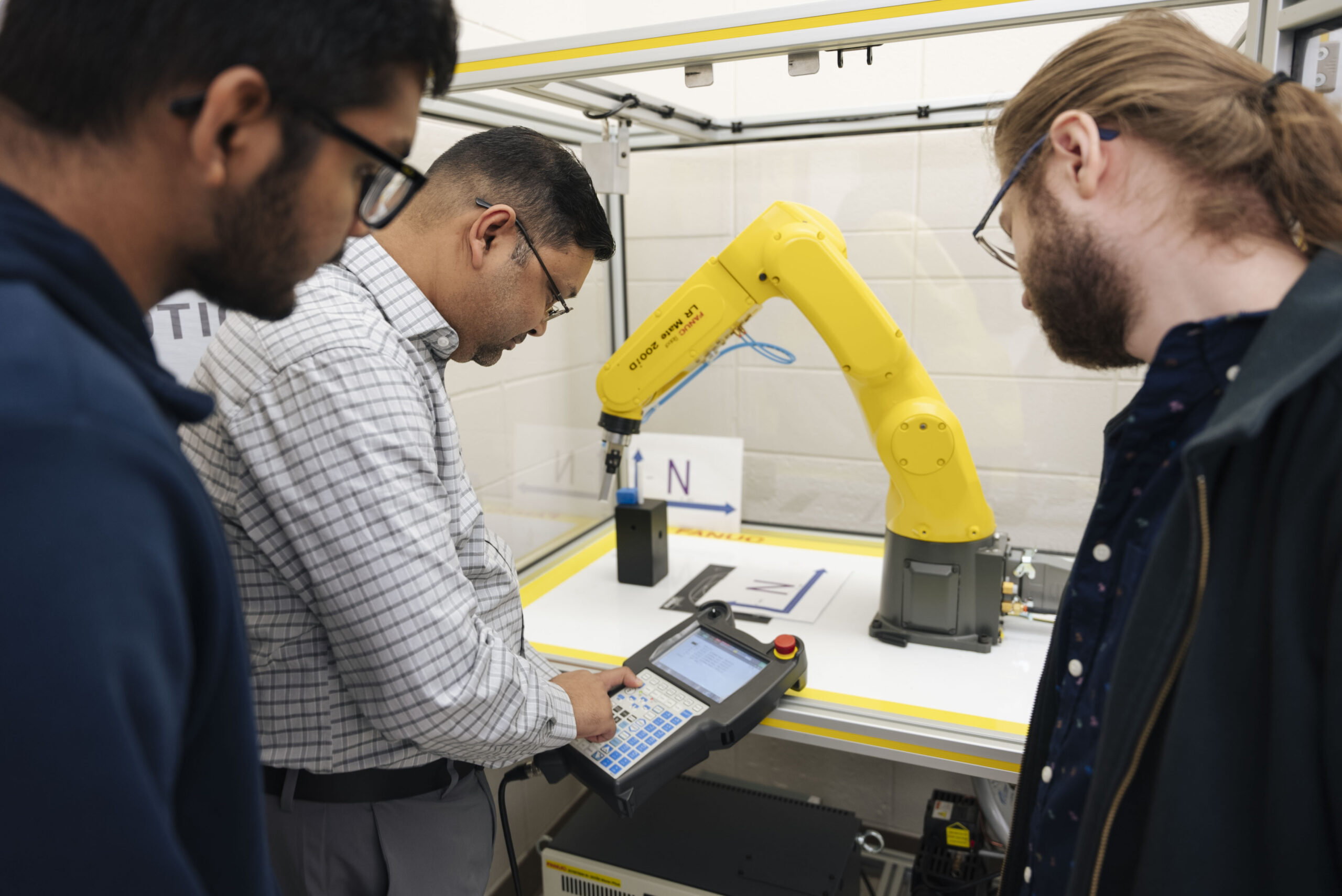 Engineering students learn from experienced faculty
