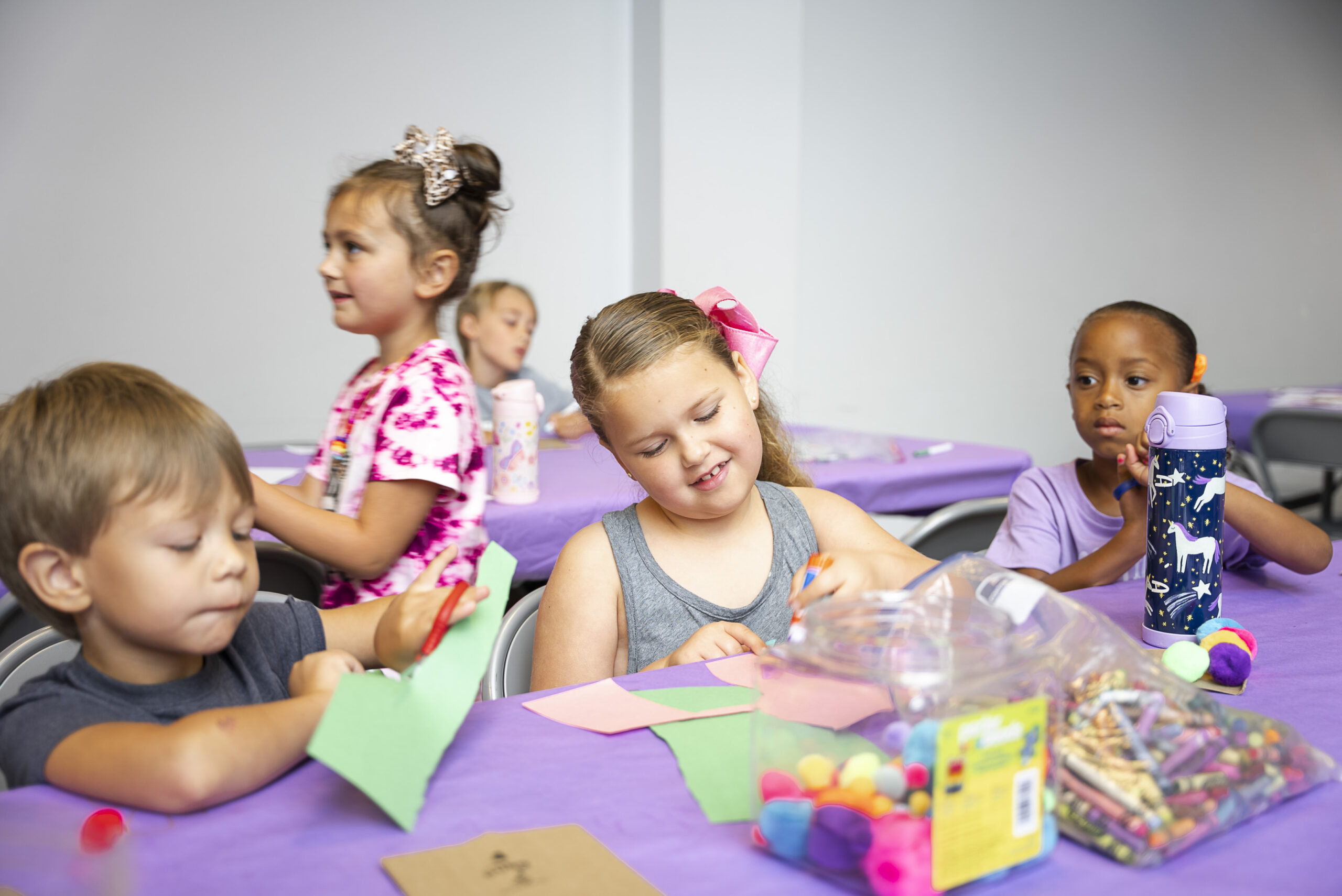 Young students participate in paper crafts at Fun & Fitness Camp