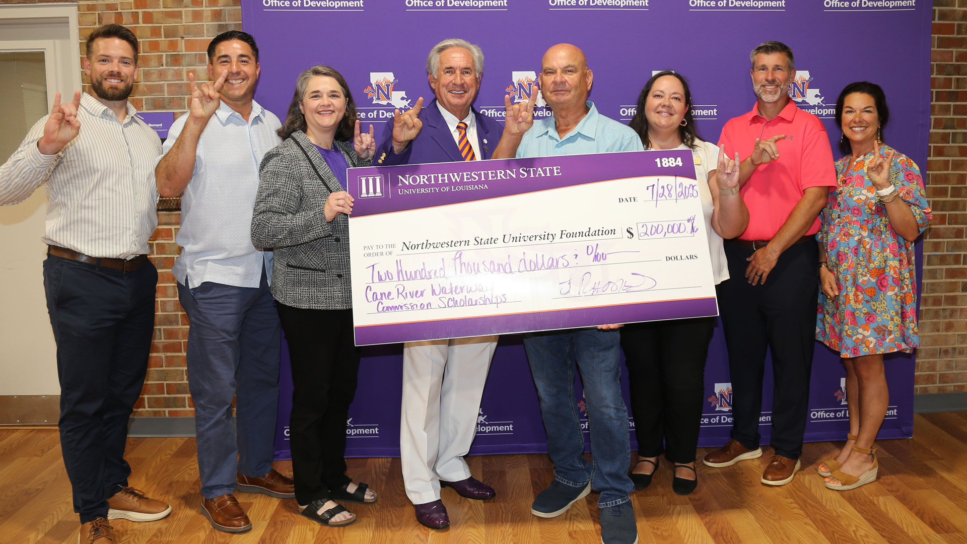Representatives from Natchitoches Parish schools joined NSU administrators and Jim Rhodes, chair of the Cane River Waterway Commission to announce two scholarships totaling $200,000.From left are Lakeview Jr./Sr. High School Principal Chase Stepp, Natchitoches Central High School Principal Micah Coleman, Dr. Fran Lemoine, dean of NSU’s College of Arts and Sciences; NSU President Dr. James Genovese, Rhodes, Natchitoches Parish School Board President Reba Phelps, St. Mary’s Principal Stephen Wren and St. Mary’s Director of Student Services Christie Griffin.