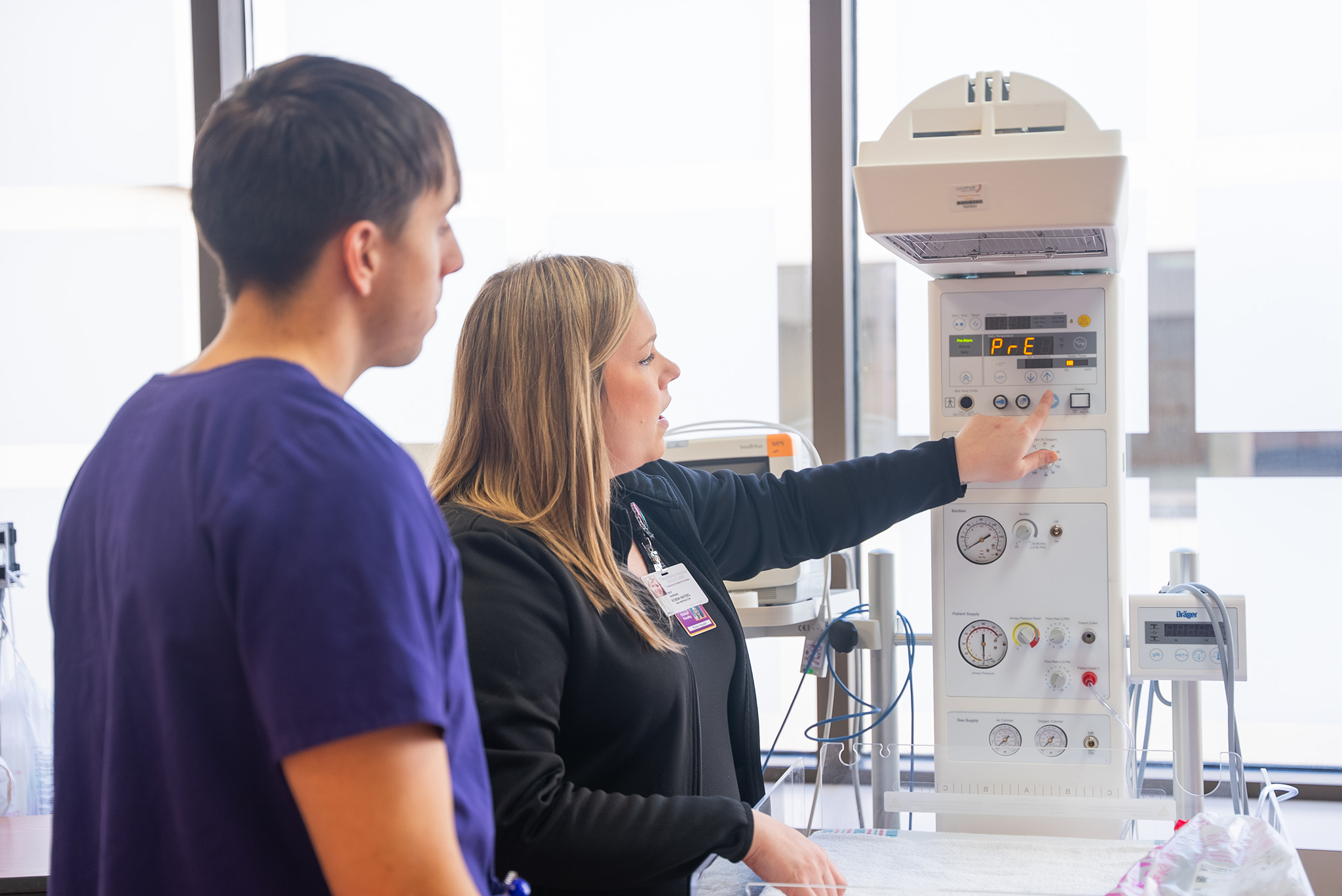 NSU instructor demonstrates equipment operation to student