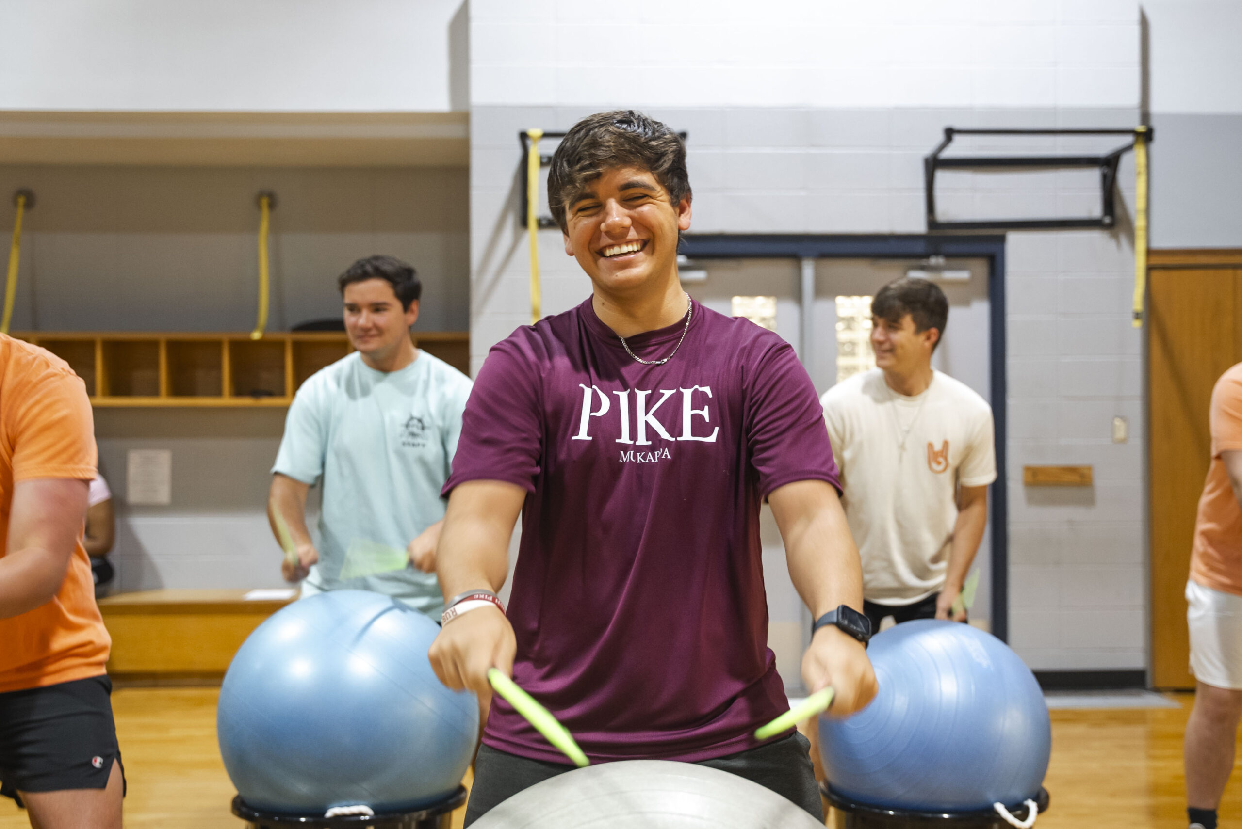NSU student laughs as he enjoy a pound class at the WRAC