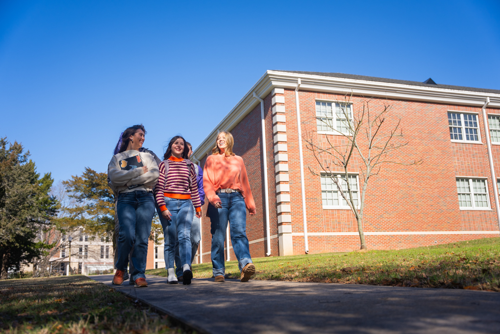 NSU students walk on sidewalk to class