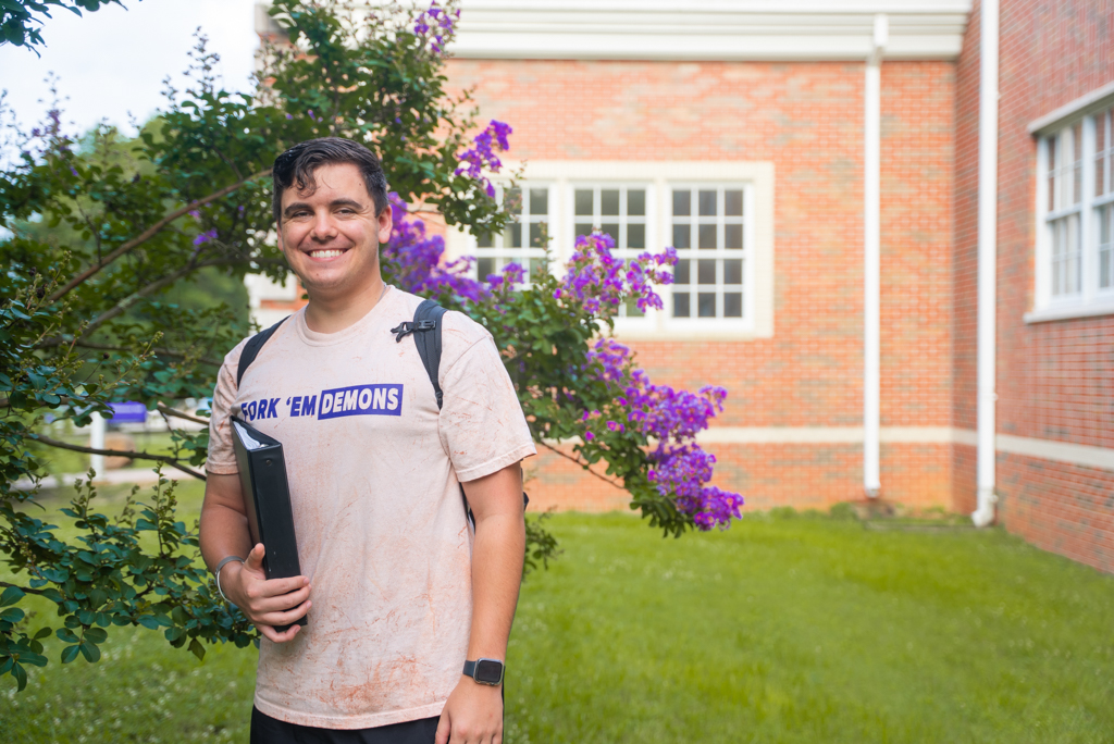 NSU student poses for photo on his way to class