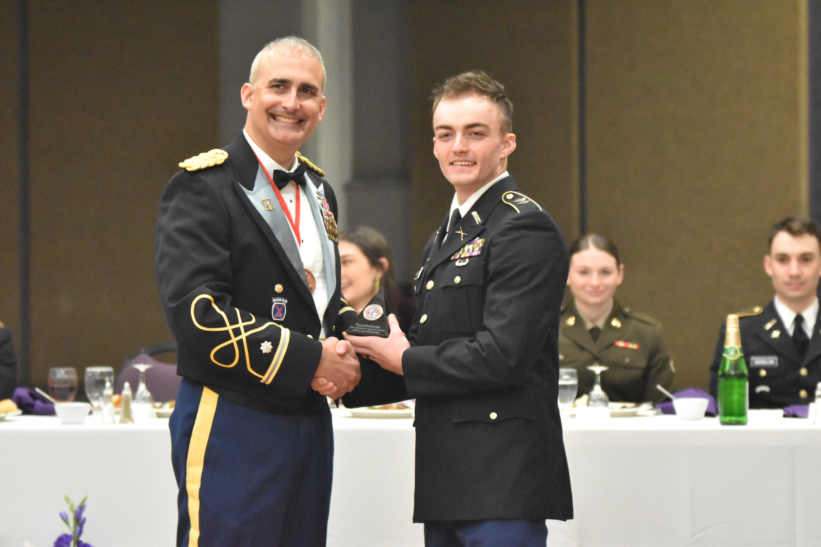 ROTC cadet accepts award at ceremony