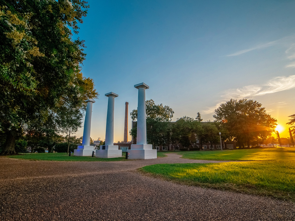 Iconic three columns on Normal Hill at sunset
