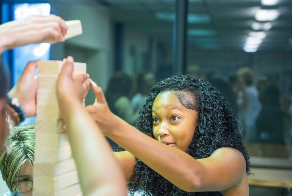 NSU student playing Jenga at Library