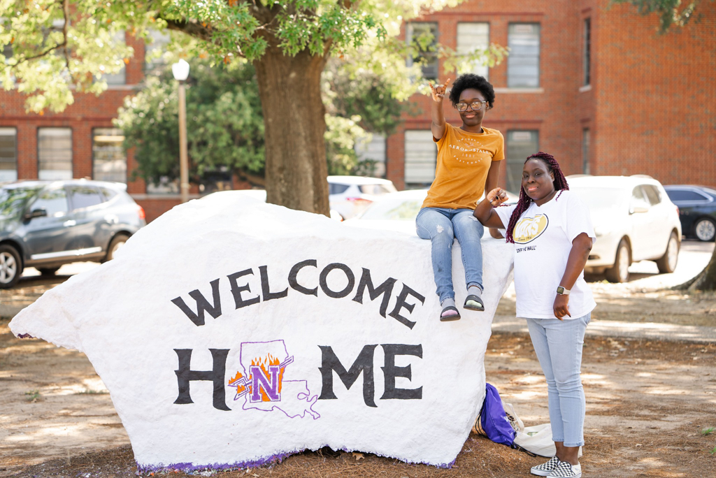NSU students painting the rock on main campus
