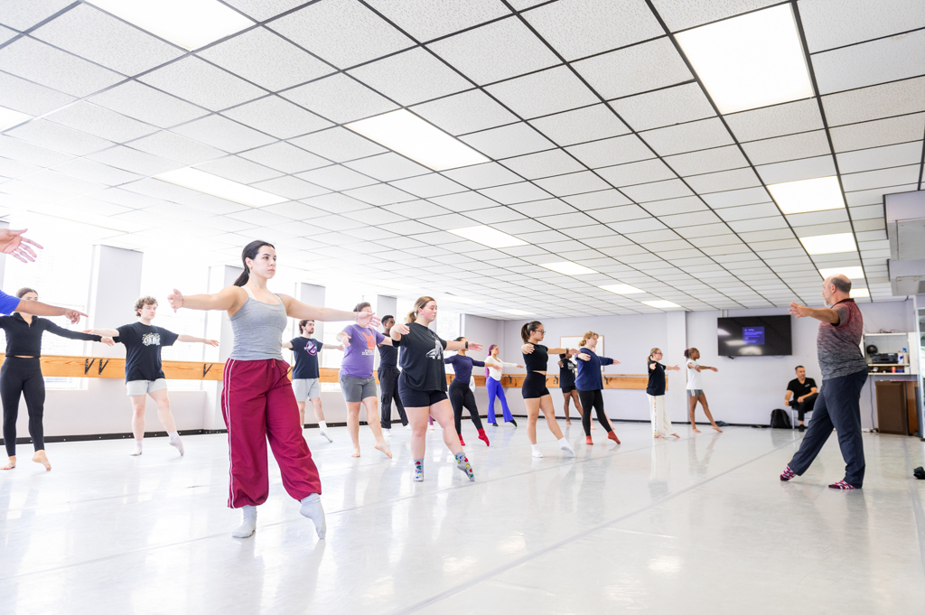 NSU Dance instructor demonstrates technique in front of a class