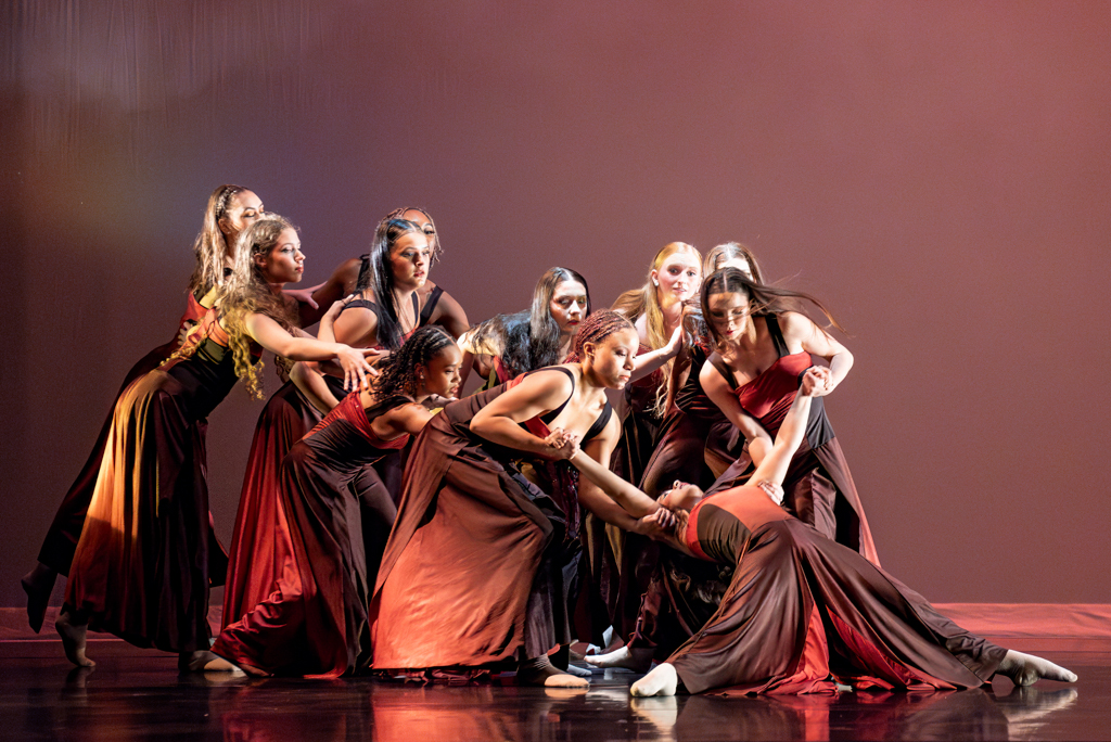 A group of NSU dance students perform on stage