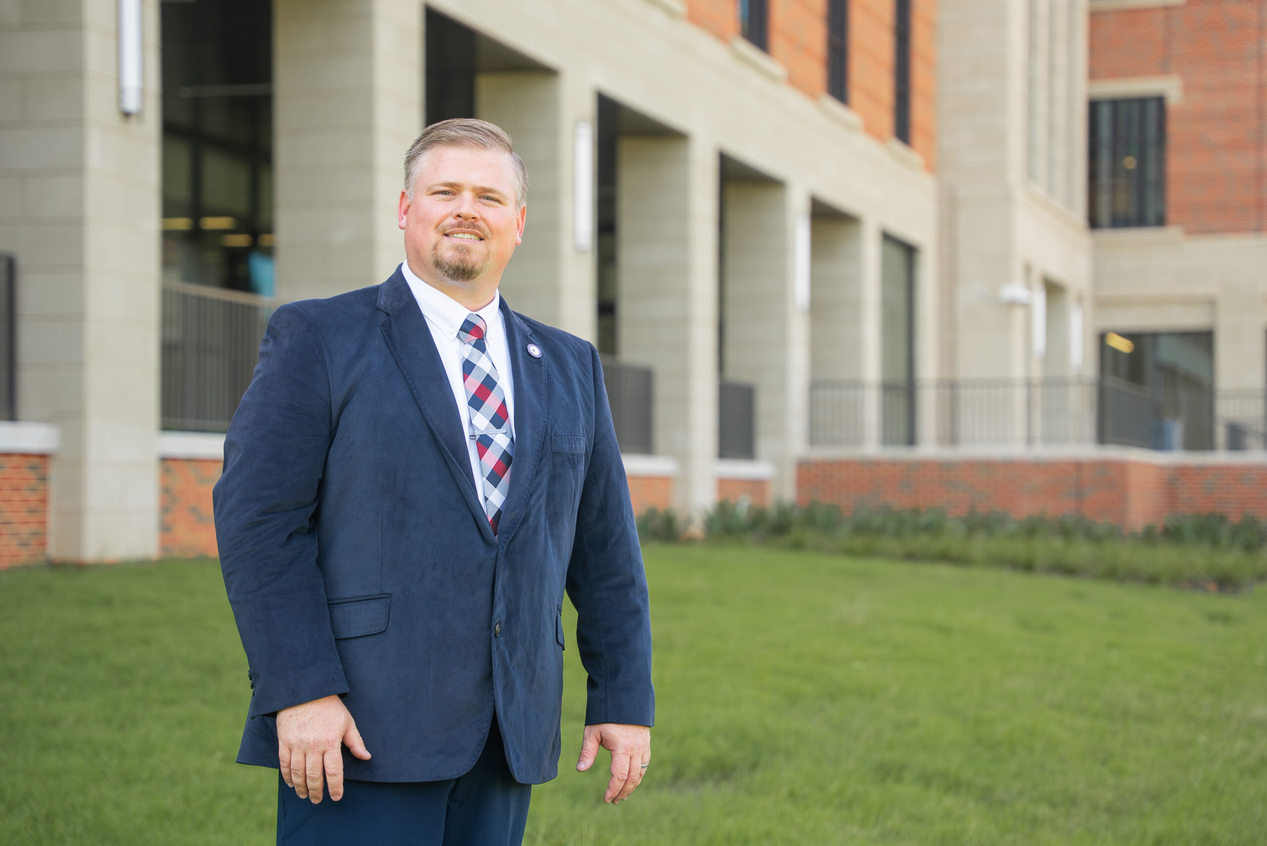Rodney Wilson standing in front of a building