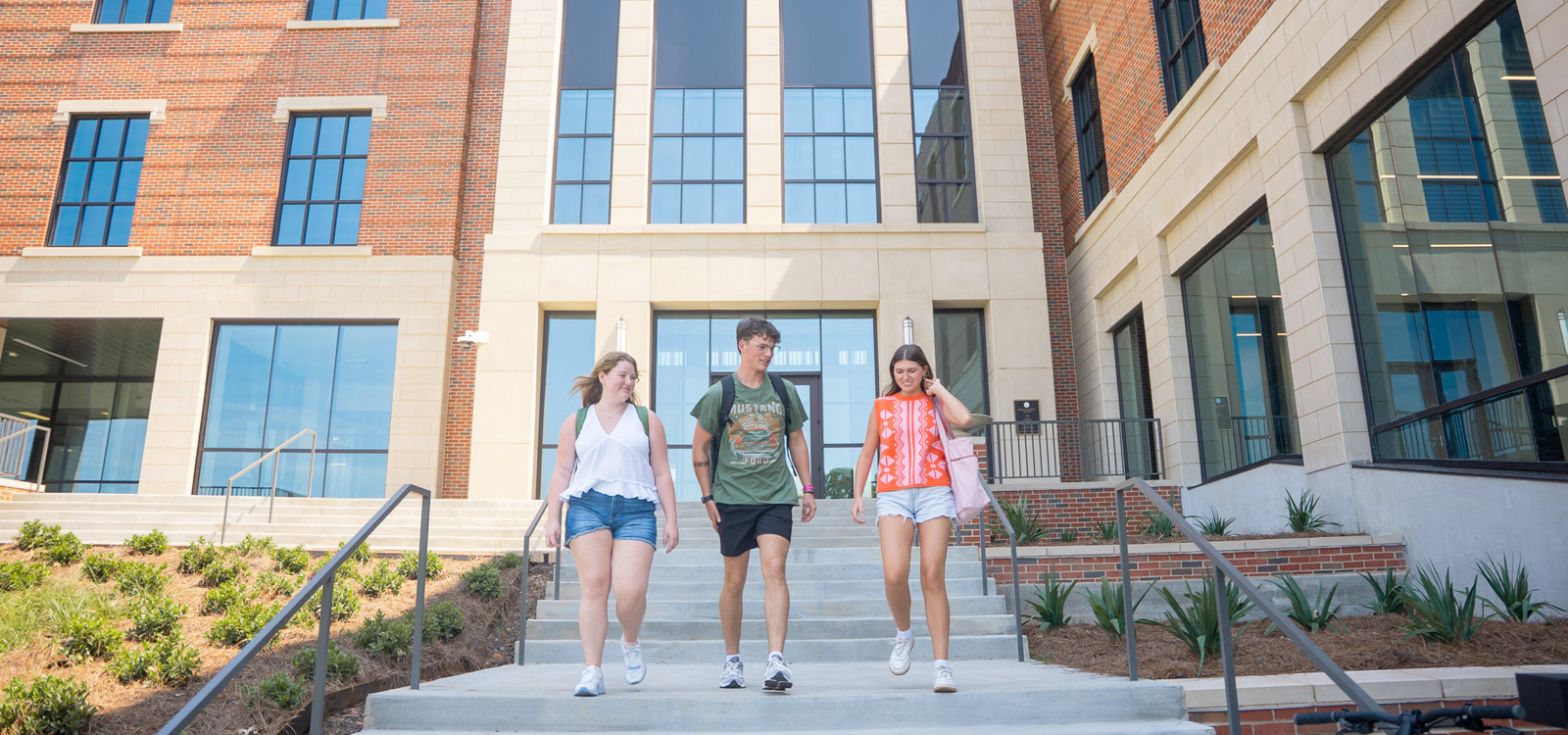 NSU students walking down steps at Alost Hall