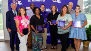 Northwestern State University recognized employees with 25 years of service. From left are President James Genovese, Dr. Dana Clawson, Dr. Charles King accepting on behalf of Dr. Cynthia Linsey; Sontonia Helaire, Dr. Thomas Reynolds, Renee Downey, Kristi Salard, Dr. J. Mark Thompson and Kristi Waters.