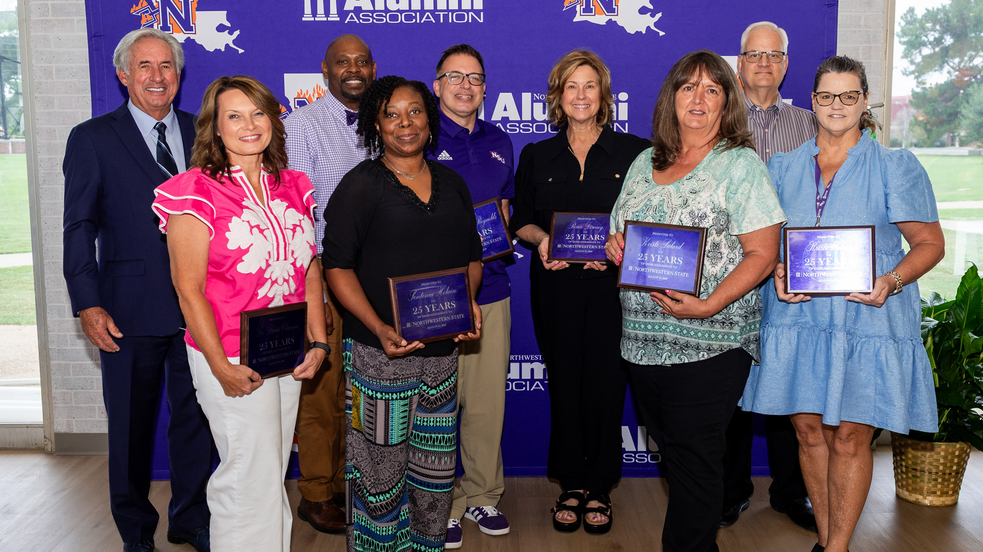 Northwestern State University recognized employees with 25 years of service. From left are President James Genovese, Dr. Dana Clawson, Dr. Charles King accepting on behalf of Dr. Cynthia Linsey; Sontonia Helaire, Dr. Thomas Reynolds, Renee Downey, Kristi Salard, Dr. J. Mark Thompson and Kristi Waters.