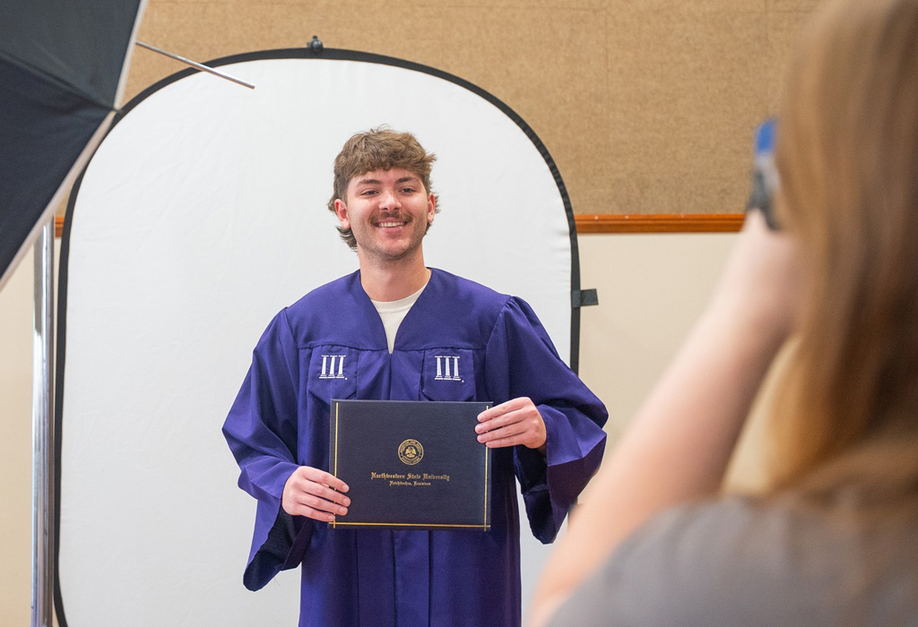 NSU student attends graduation cap and gown pictures