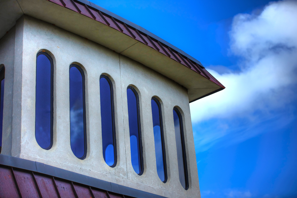 Teacher Education Center window reflection with blue skies