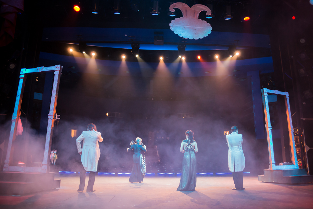 Actors on stage during a performance or rehearsal in the theater