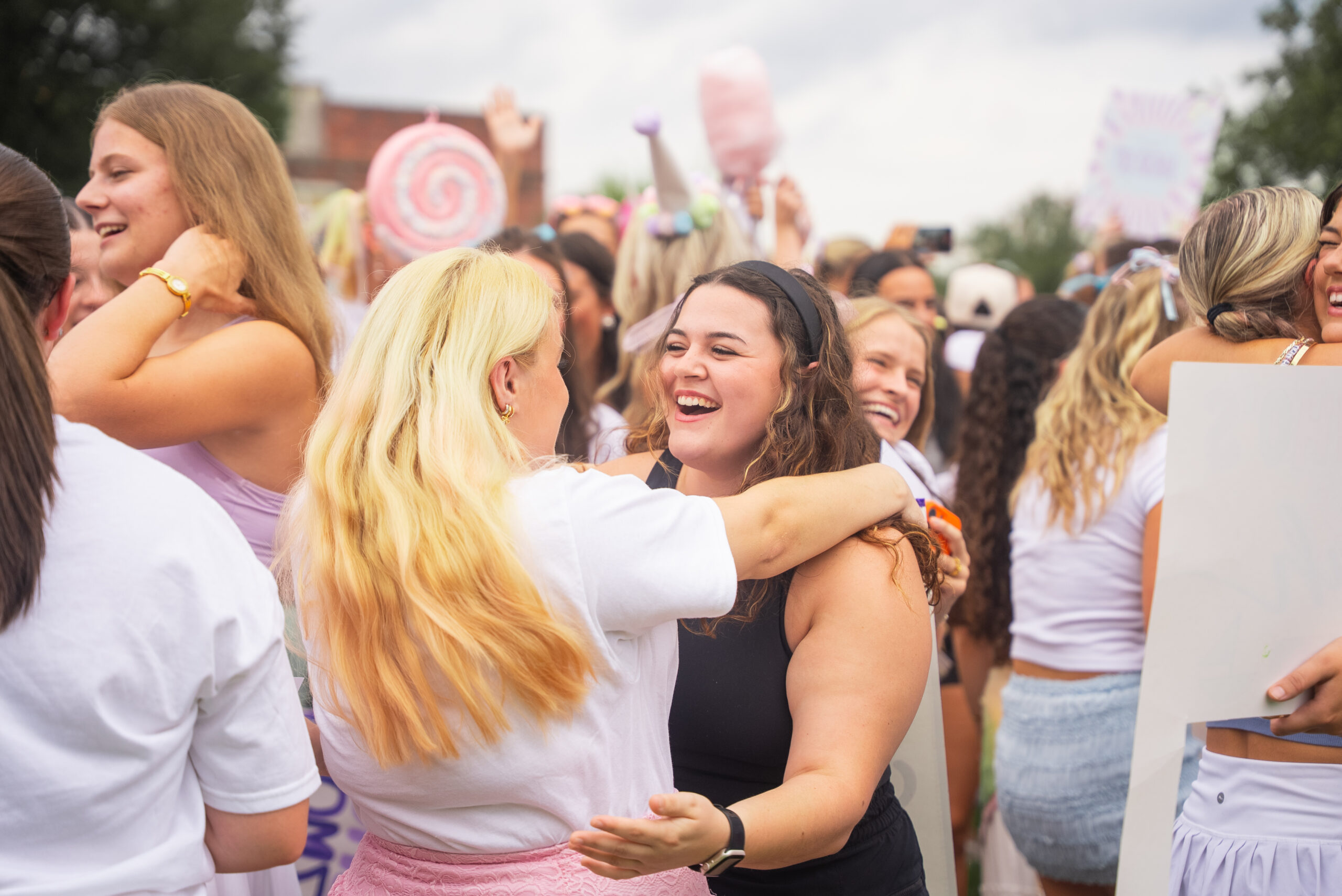 girls hugging at sorority bid day