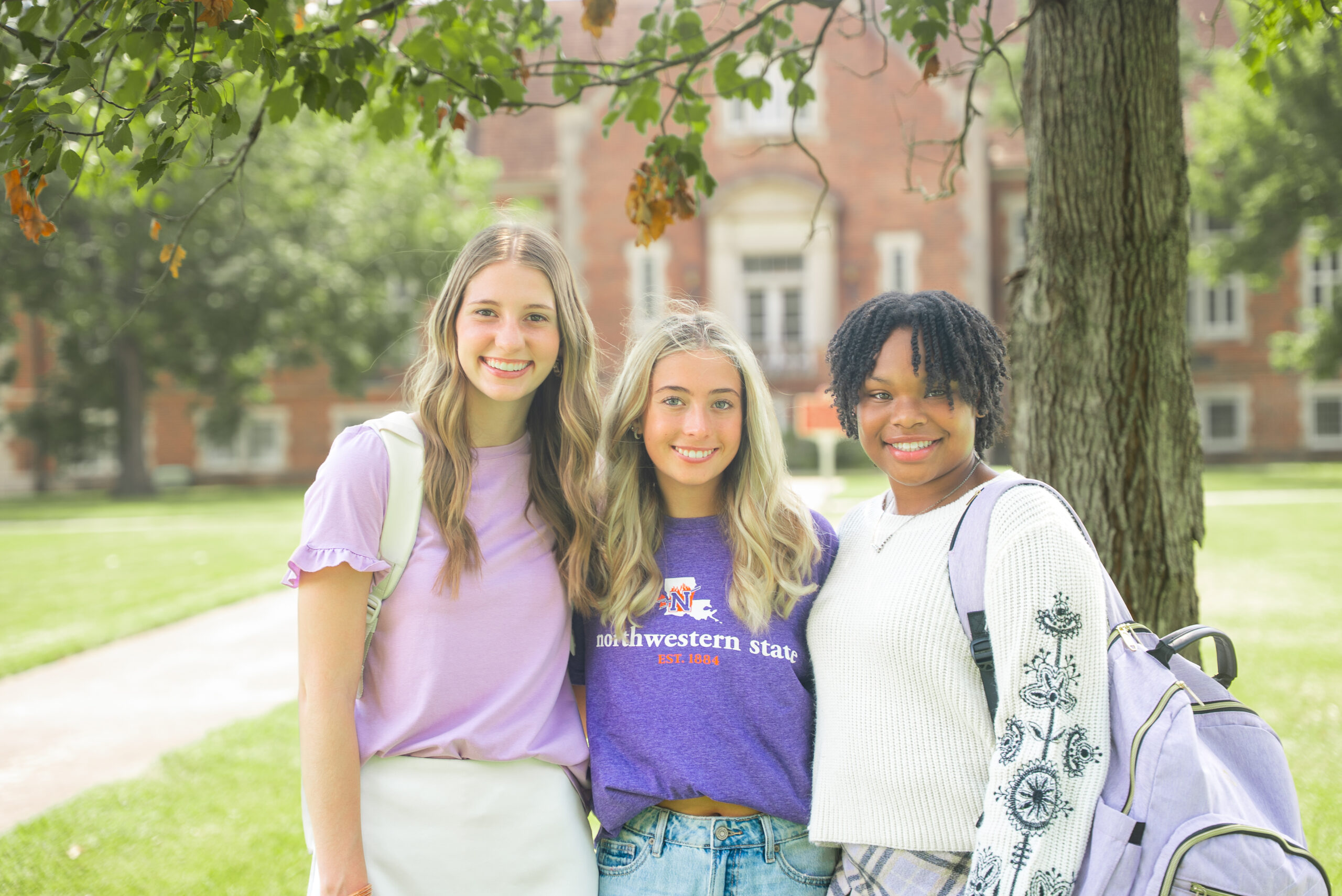 students posing on NSU's campus