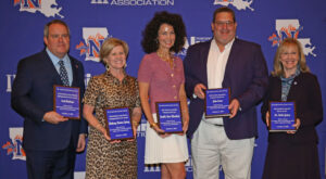 NSU presented awards to several individuals for their contributions, service and volunteerism to the university.  From left are Scott Andrews, Reatha Cox representing Brittany Burton Spivey, Camille Nunez Blanchard, John Evans and Dr. Vickie Gentry. 