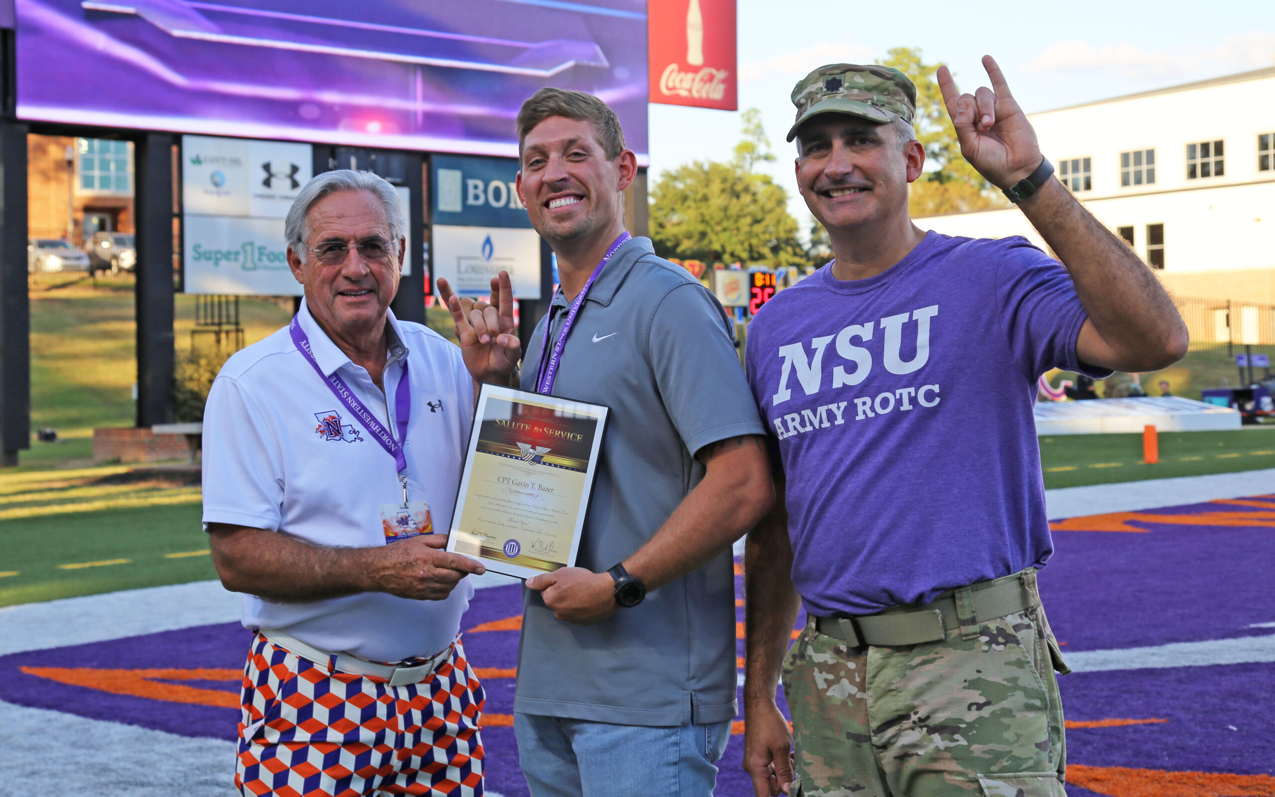 NSU welcomed Captain Gavin Bazer as the honorary guest captain during the Demon Football Homecoming game Oct. 4. From left are NSU President James Genovese, Bazer and LTC Joshua Drake, head of NSU’s Department of Military Science.