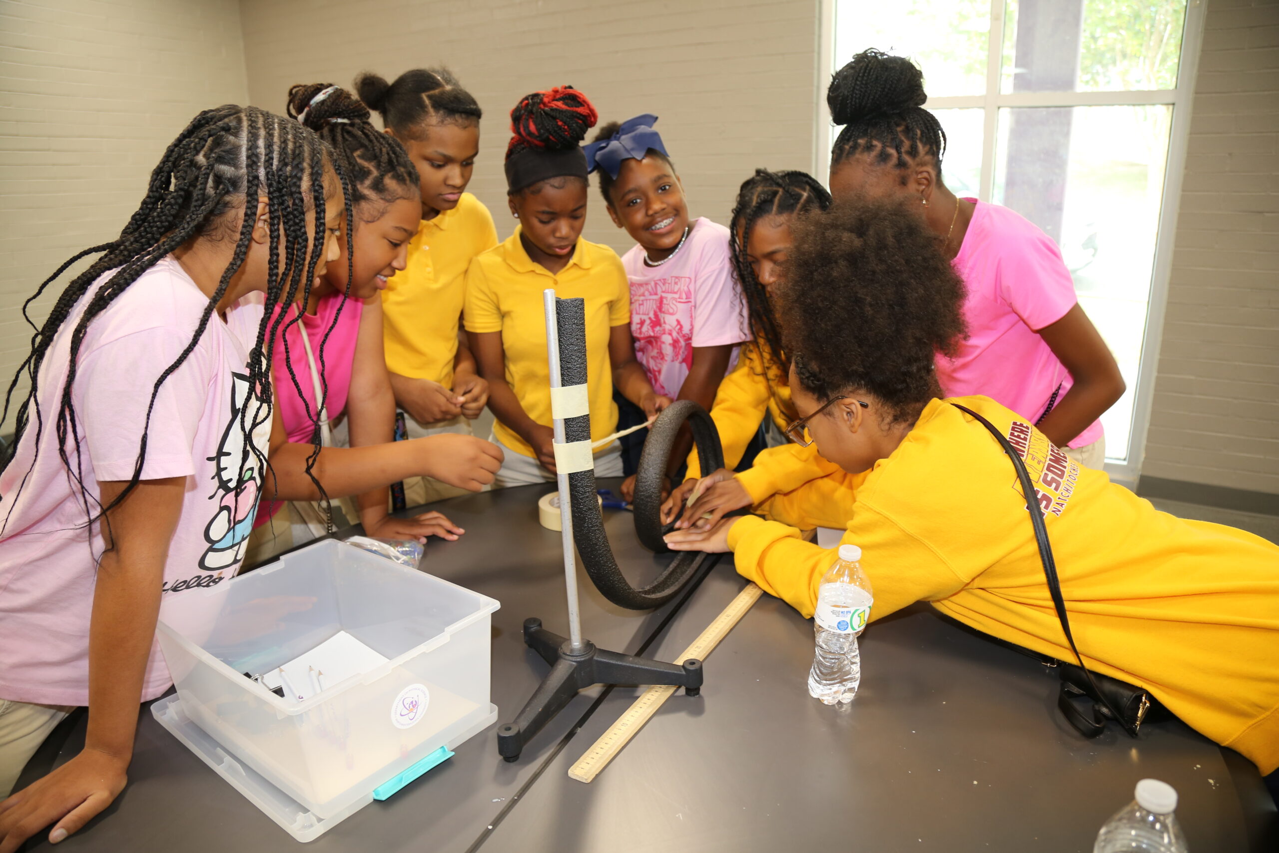 Natchitoches Jr. High students Aretha Potter, Zariah Pearrie, Janiah Heard, Lyric Thomas, Mariah Robinson, Harmony Remo, Ja’Kiera Humphrey and Jenissy Robinson participated in the “Factory Physics Challenge” during NSU’s Engineering Technology Symposium Oct. 17. The all-female team of sixth and seventh graders won the competition for being the first to successfully design a gravity-powered factory line that delivered a marble into a cup using pipe insulation, tape and binder clips.