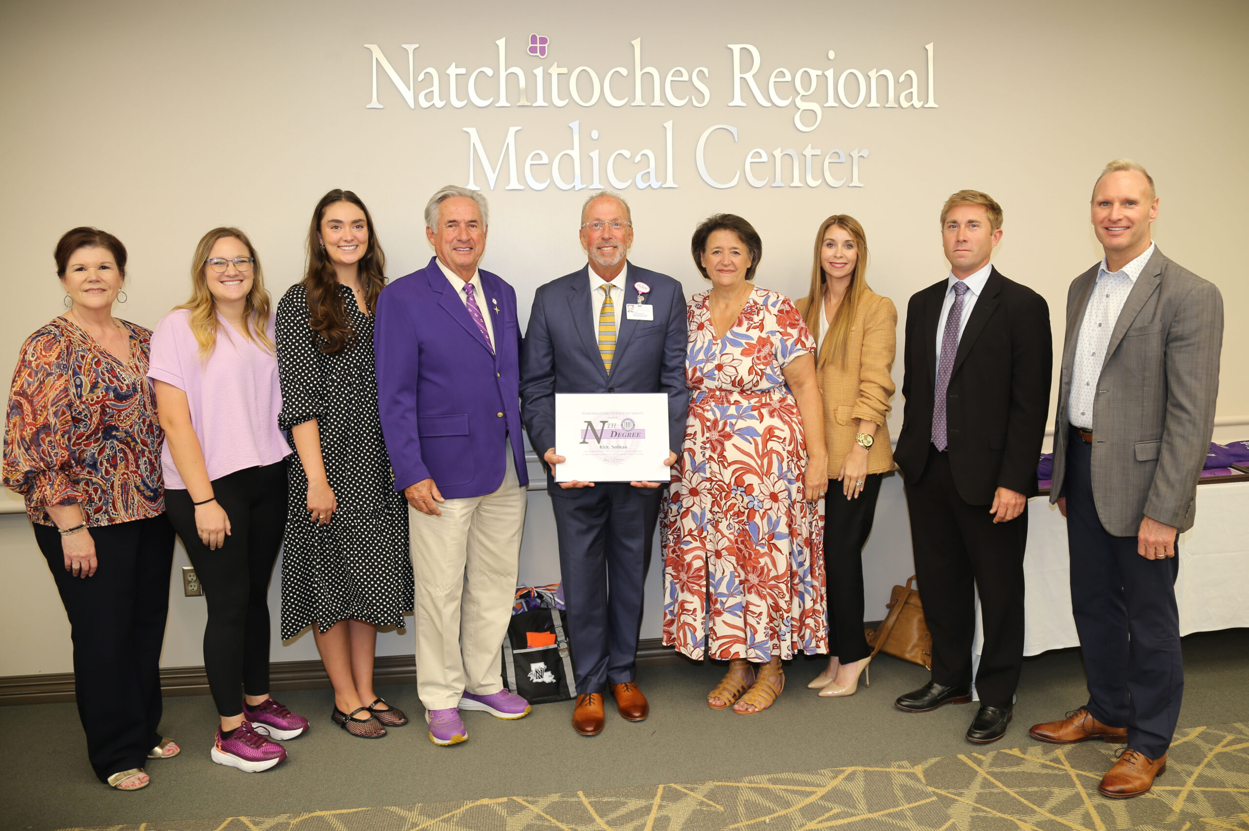 Northwestern State University honored Natchitoches Regional Medical Center CEO Kirk Soileau with the Nth Degree in thanks for service to the university and the community. From left are Laurie Morrow, executive director of NSU’s Office Economic Development and University Advancement; Brittany Pajuluoma, associate athletic director for Sports Medicine and Senior Women’s Administrator; Jane Reffelt, government relations associate with Merchant McIntyre Associates; NSU President James Genovese; Soileau and his wife Marie, Dr. Aimee Badeaux, dean of NSU’s College of Nursing and School of Allied Health; Drake Owens, Genovese’s chief of staff, and Dr. Greg Handel, NSU’s executive vice president and provost.