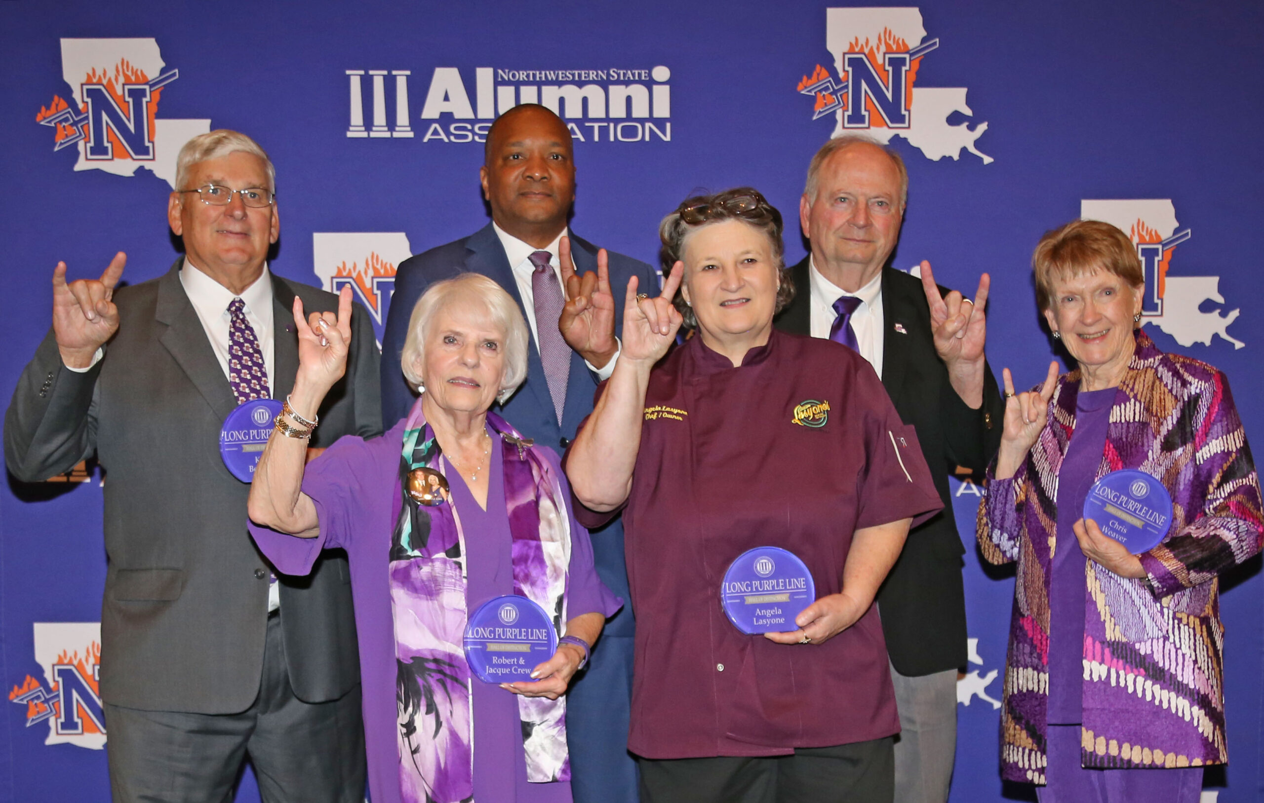 Northwestern State University inducted seven alumni in the Long Purple Line Friday as part of Homecoming festivities. From left are Richard Keith Bergeron, Jacque Crew, who was inducted along with her husband, the late Robert Crew; Dr. Marcus Jones, Angela Lasyone, Lee Posey and Chris Weaver. Induction into the Long Purple Line is the highest honor NSU bestows upon alumni.