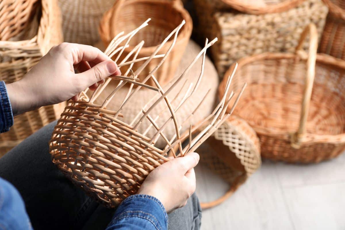 a person weaving a basket