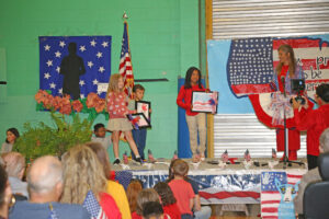 Veterans Day art contest winners were, from left, Anniston Wilkerson, Jalen Jones and Kynlee Hardison. Not shown is Kennedy Harrell. 4-H sponsor Lisa Wiggins presented the awards.
