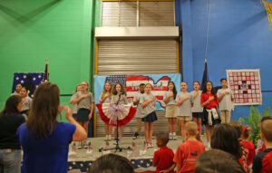 4-H Officers sang the U.S. National Anthem, directed by vocal teacher D’Nissa Hester.