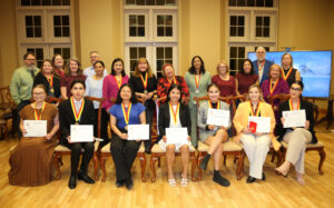 Seated from left are new Phi Beta Delta members Shae Wetzel, Santiago Tobon Cardona, Tatiana Wing Lam Wu, Maria Camilla Valencia Gonzalez, Angee Mariana Bedoya Rivera, Katherine Clary and Salome Aristizabal Aguirre. On the back row are chapter members Dr. James Smith, Debbie Huntington, Donna Baker, Christine Ferrell, Dr. Damien Tristant, Valentina Herazo Alvarez, Dr. Weiwen Liao, Dr. Marcia Hardy, Dr. Elizabeth Prejean, Dr. Neeru Deep, Dr. Pamela Francis, Shannon Hale, Dr. Greg Granger, Dr. Sharon Joy and Anna MacDonald.
