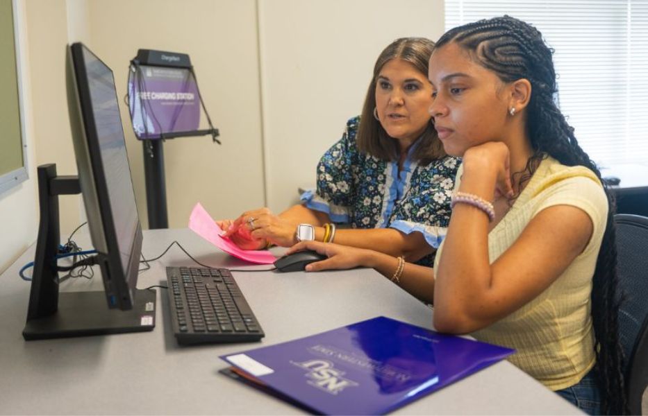 Students looking at a computer screen.