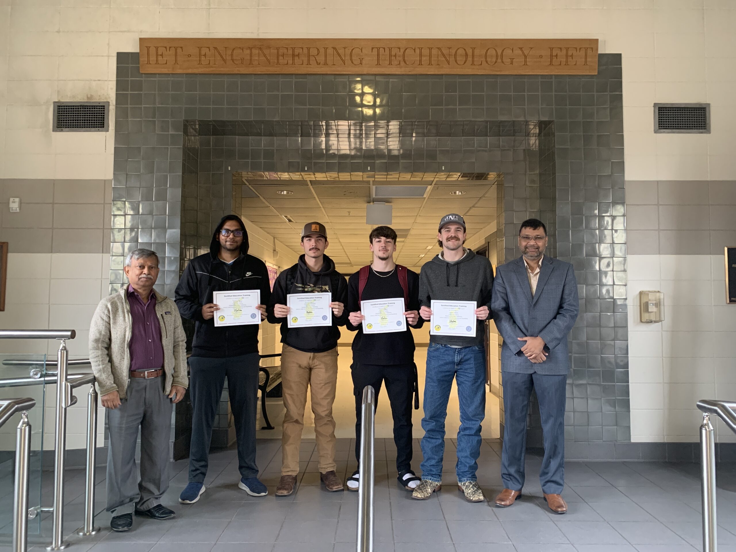 A group of four Northwestern State University students in the Department of Engineering Technology were among the first group at NSU to successfully complete the FANUC (Fuji Automatic Numerical Control) CERT Handling Tool Operations and Programming Level 1 training. Shown, from left, are Professor of Engineering Technology Dr. Rafiqul Islam, Abdullah Yusuf of Dhaka, Bangladesh, Christopher Ezernack and Ethan Goldberg of Many and Carson Comeaux of Robeline and head of the Department of Industrial Technology and Associate Professor Dr. Shahriar Hossain.