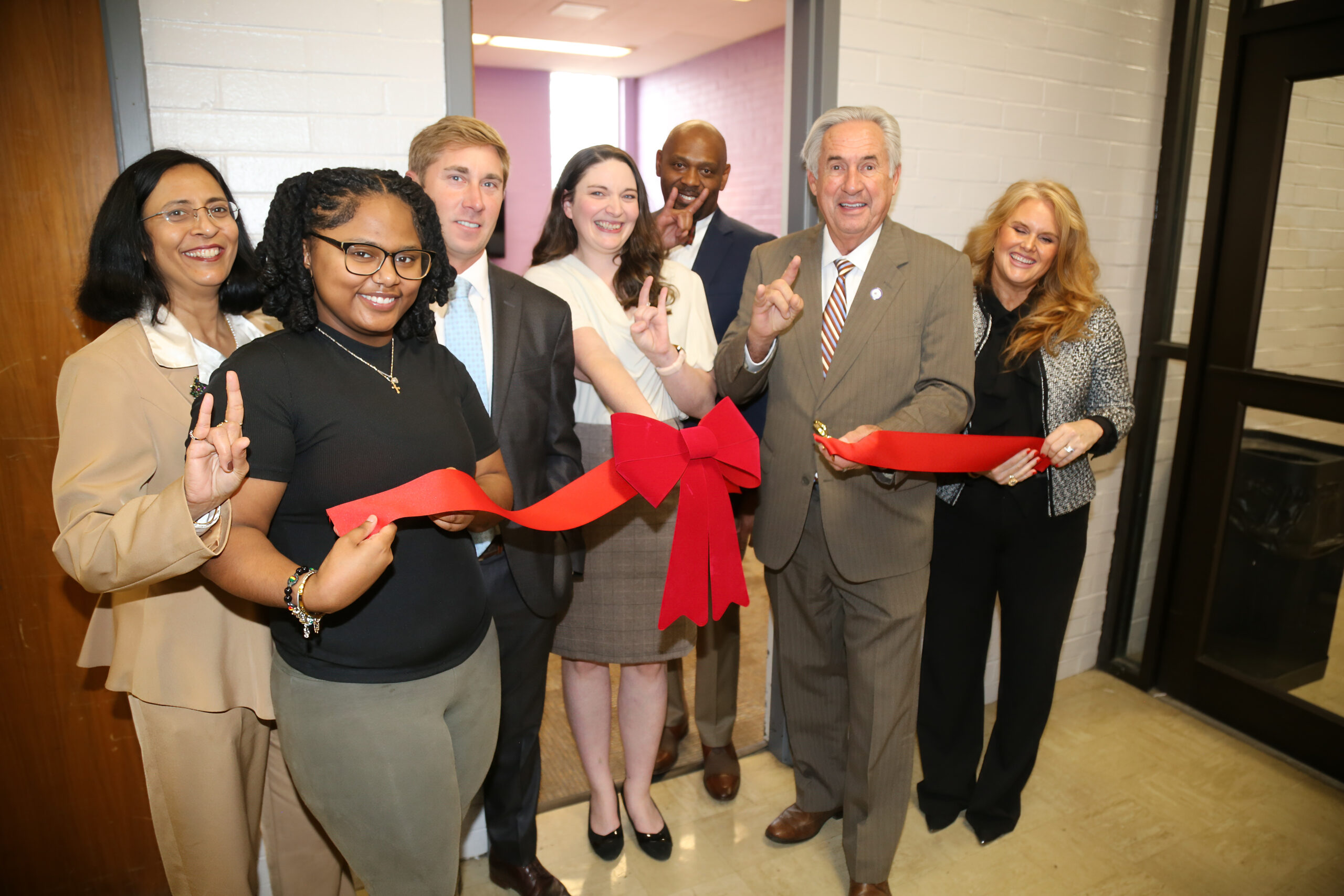 A ribbon-cutting officially opened the Demons for Recovery Lounge in NSU Student Room 313. From left are Dr. Neeru Deep, dean of NSU’s Gallaspy College of Education and Human Development; graduate assistant Kabrian Francois of Lake Charles, Drake Owens, Chief of Staff to the president; Sarah Ebarb, Demons for Recovery coordinator, Dr. Charles King, interim head of the Department of Psychology and Addiction Studies, NSU President James Genovese and Hillary Bennett, a recent Master’s degree graduate who contributed to coordinating NSU’s College Recovery and Prevention Program.