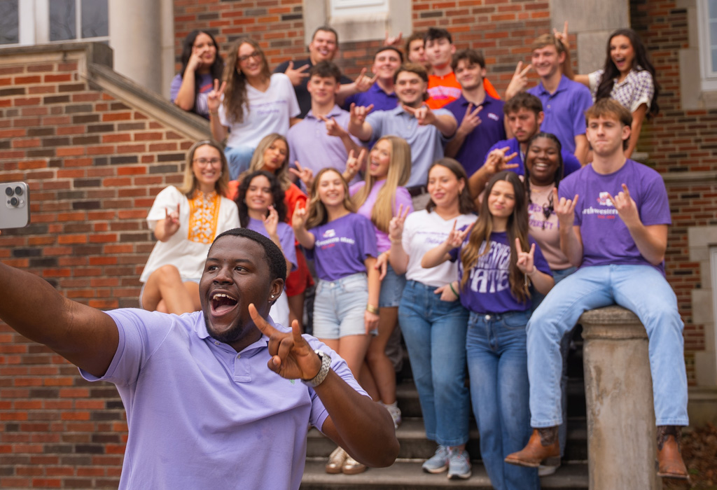 Group of NSU students pose on steps at Russell Hall