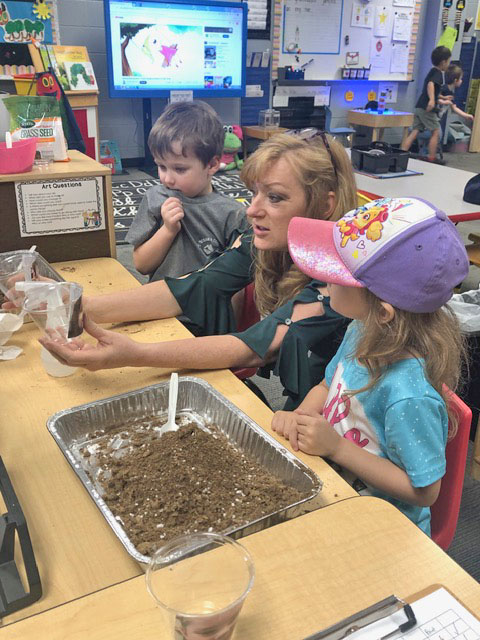 Dr. Debra Jo Hailey worked with children in a Pre-K classroom at Jena Elementary on Dr. Seuss Day.