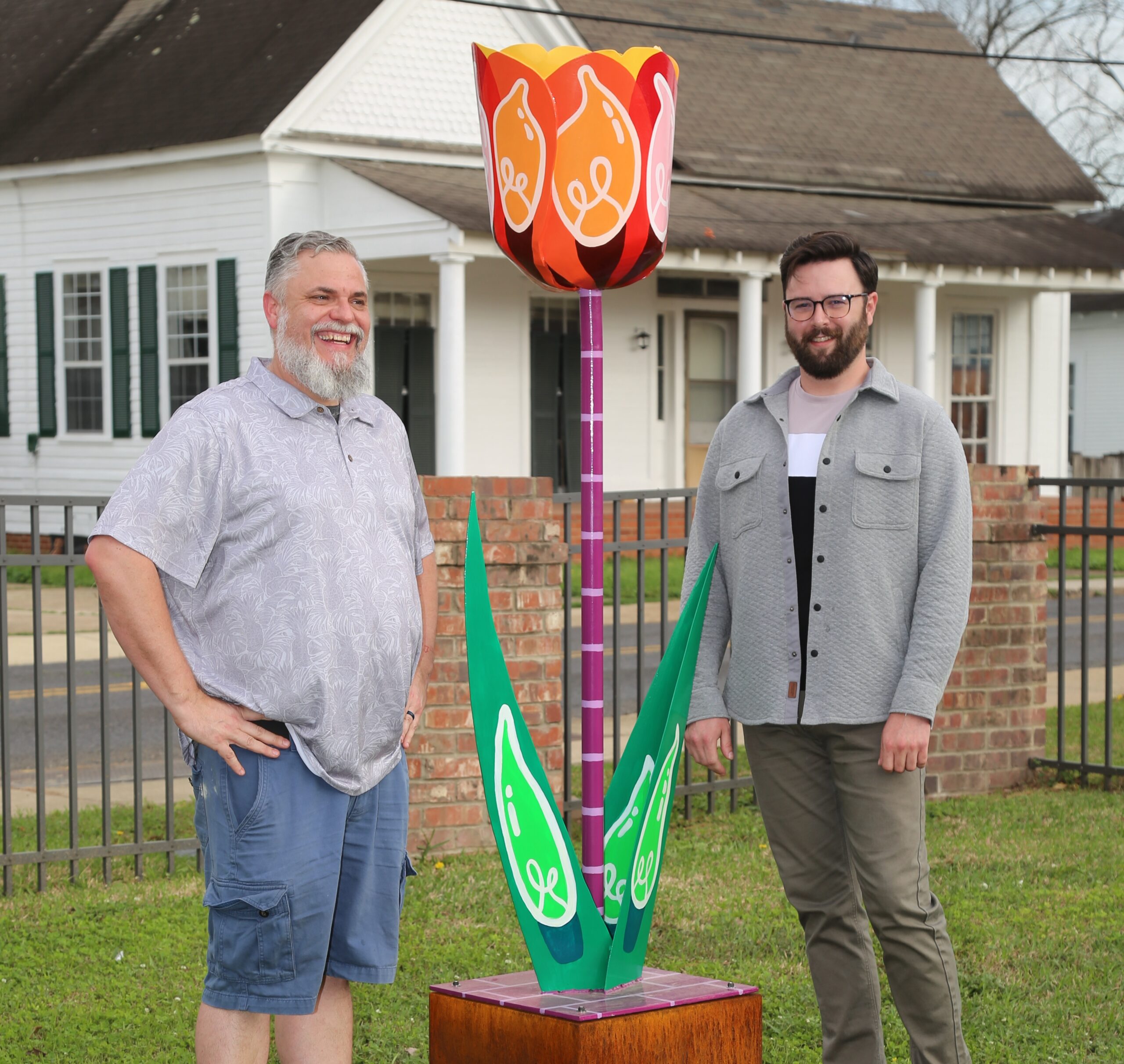 Professor of Art Corbin Covher and NSU alum Ethan McManus unveiled the latest Natchitoches in Bloom sculpture, a tulip painted with a Christmas lights motif. The sculpture is in the BOM Bank fountain courtyard, 814 Washington St.