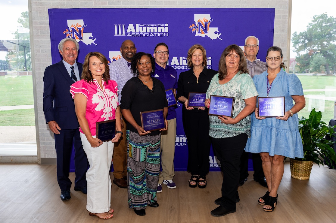 Northwestern State University recognized employees with 25 years of service. From left are President James Genovese, Dr. Dana Clawson, Dr. Charles King accepting on behalf of Dr. Cynthia Linsey; Sontonia Helaire, Dr. Thomas Reynolds, Renee Downey, Kristi Salard, Dr. J. Mark Thompson and Kristi Waters.