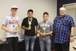 Demon Second Place Winners Harper Marcotte, Javier Sanchez, Joseph Rodriguez, with Dr. Nicholas Richardson, School of STEM (Not shown is Jack Odom.)