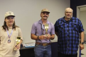 Third place winners Cody Carmen and Daniel Gallager with Dr. Nicholas Richardon, School of STEM (Not pictured is Gabe Chisholm.)