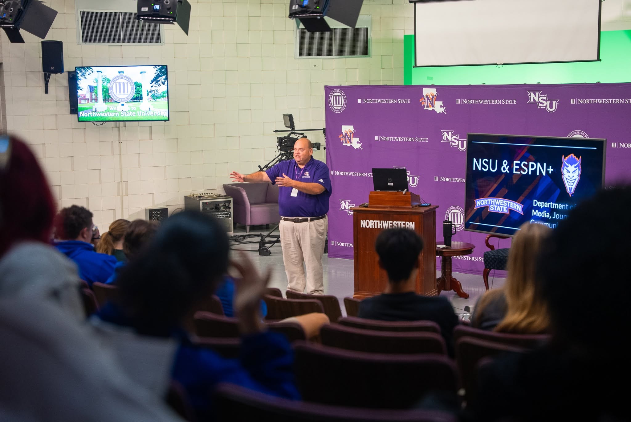 NSU tv studio with someone speaking to a crowd