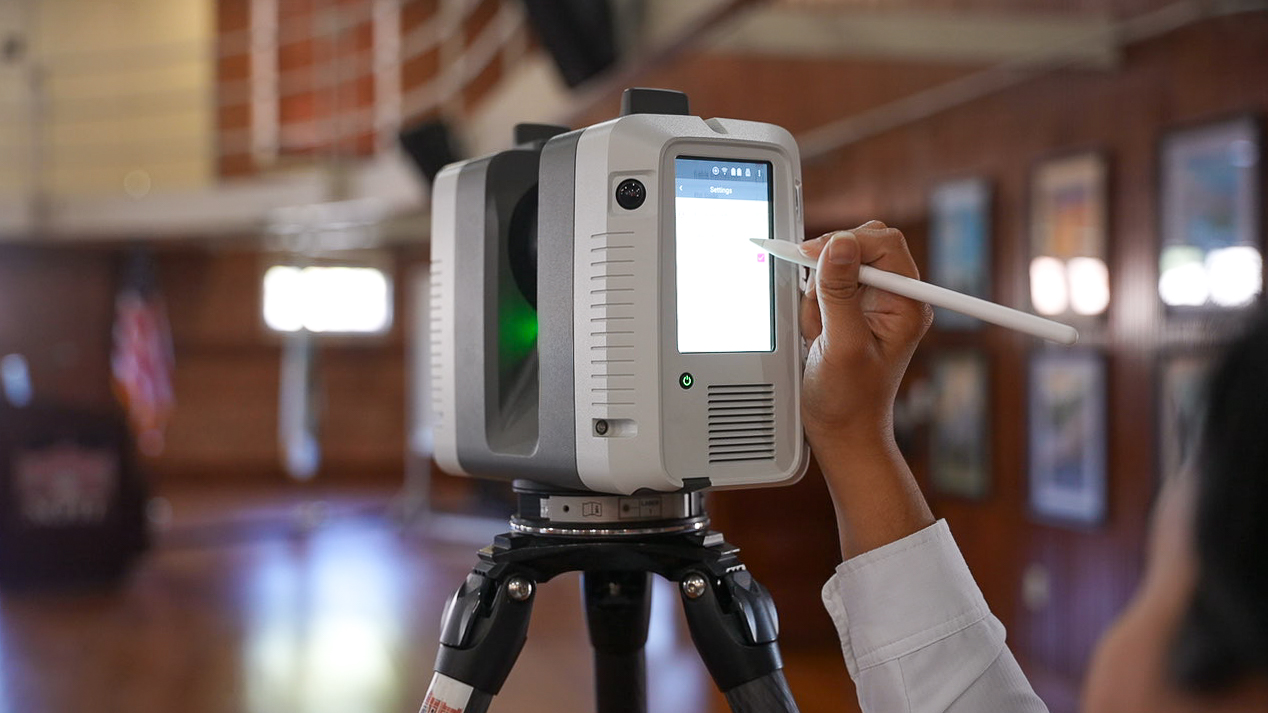 Megan Reed, senior laser scanning research associate, works with LiDAR equipment used to document historic sites.