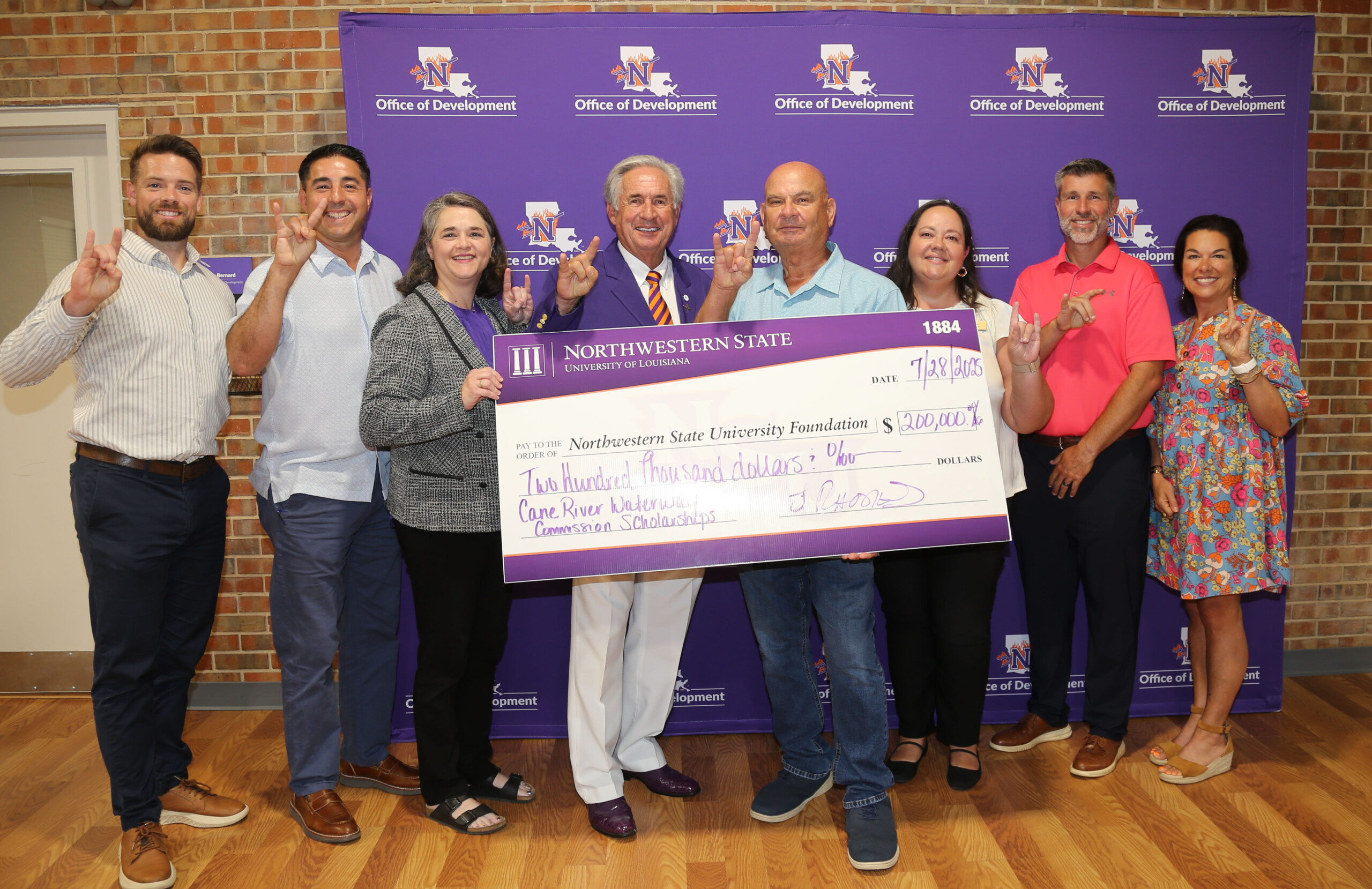 Representatives from Natchitoches Parish schools joined NSU administrators and Jim Rhodes, chair of the Cane River Waterway Commission to announce two scholarships totaling $200,000.From left are Lakeview Jr./Sr. High School Principal Chase Stepp, Natchitoches Central High School Principal Micah Coleman, Dr. Fran Lemoine, dean of NSU’s College of Arts and Sciences; NSU President Dr. James Genovese, Rhodes, Natchitoches Parish School Board President Reba Phelps, St. Mary’s Principal Stephen Wren and St. Mary’s Director of Student Services Christie Griffin.