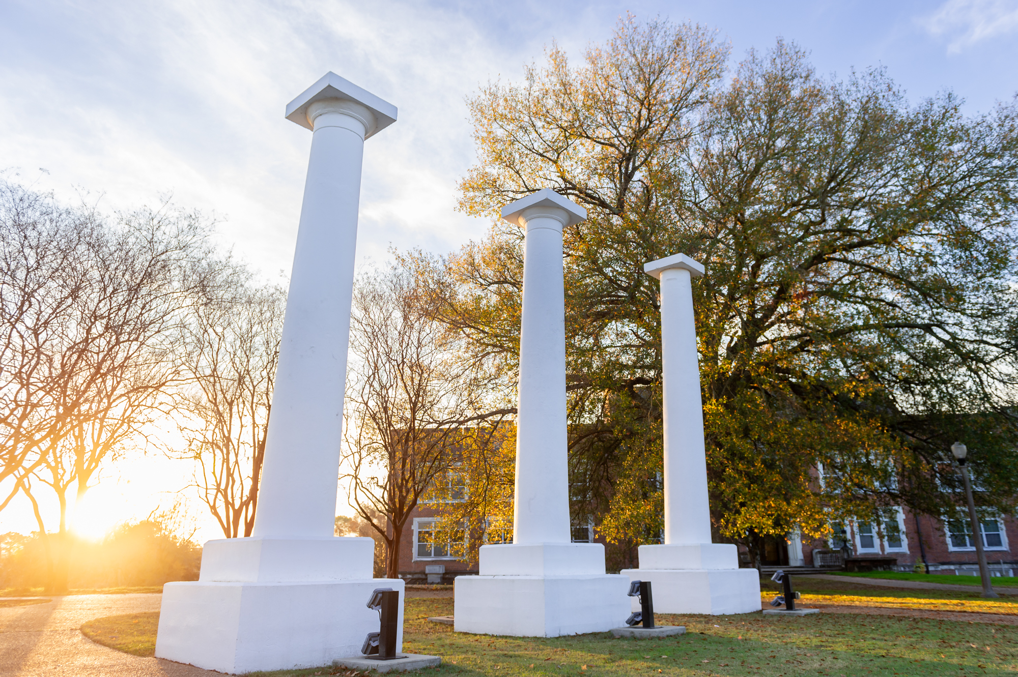 The three columns stand on the Northwestern State University campus in Natchitoches.