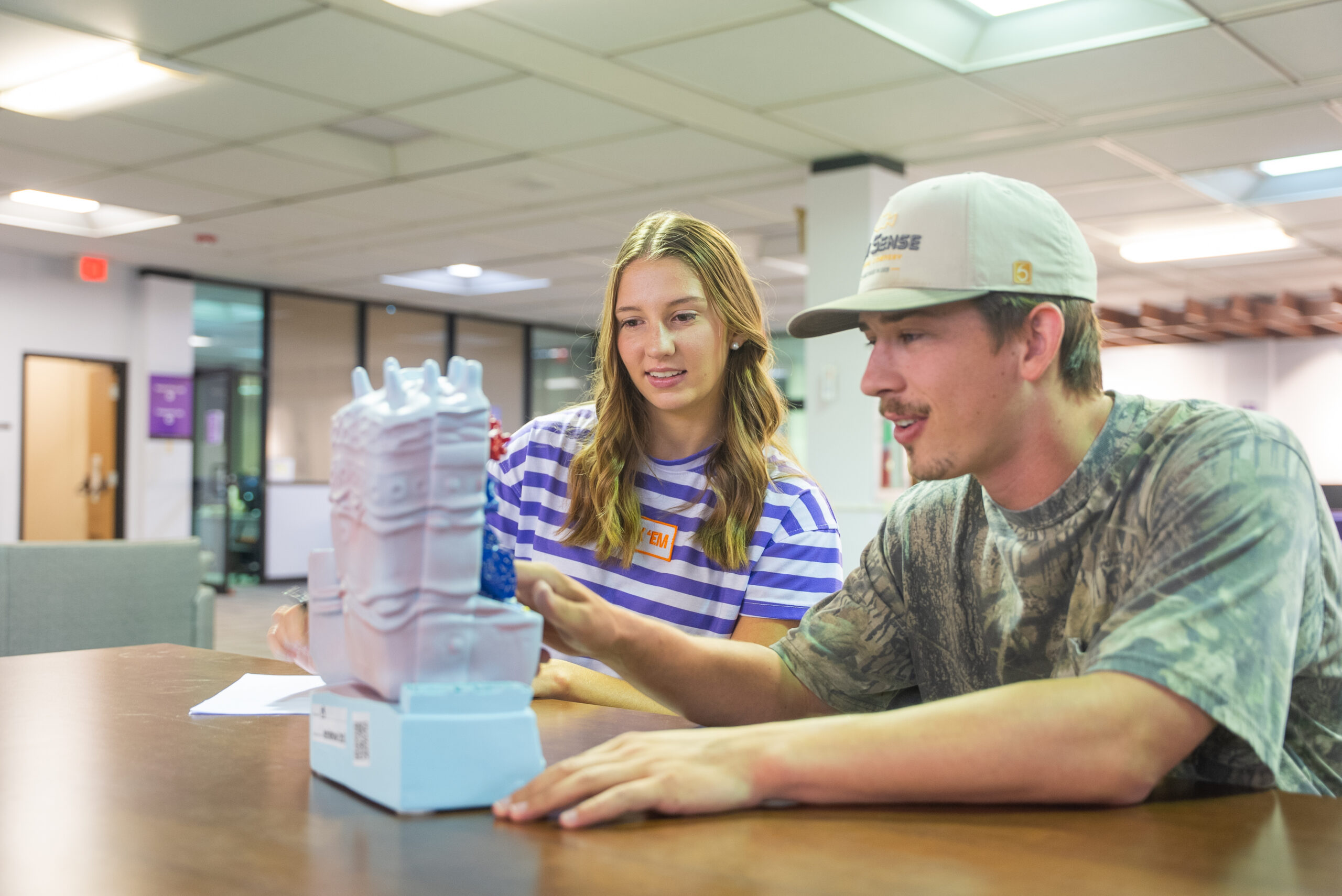 two students studying at a table together